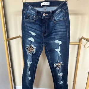 KanCan size 5/26 stretchy cute jeans with leopard print accents.